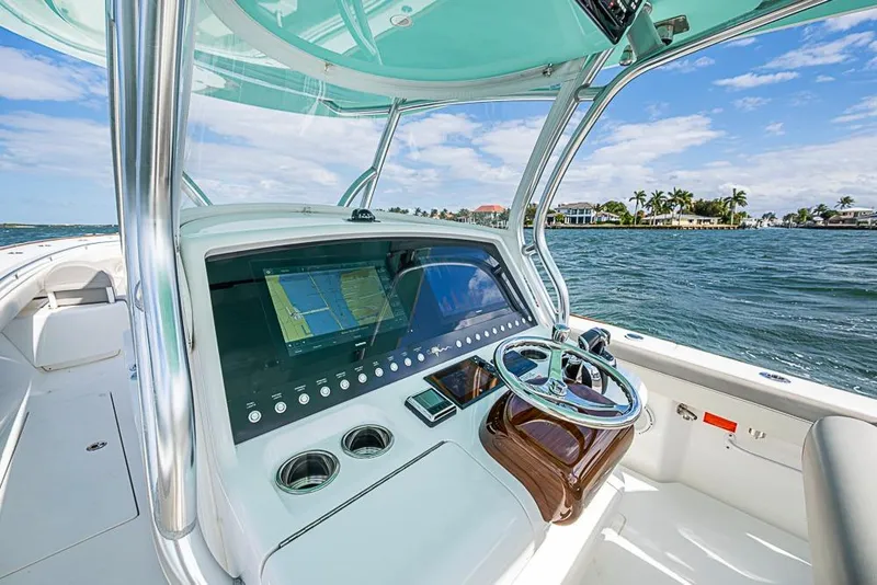 Slide: The Image of Interior view of 2020 Valhalla Boatworks V-37, showcasing helm and electronics. - 17