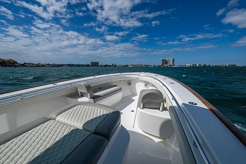 Slide: The Image of 2020 Valhalla Boatworks V-37 cruising on open water under a partly cloudy sky. - 22