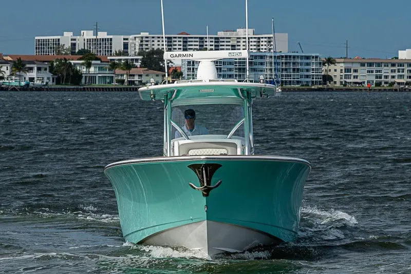 Slide: The Image of 2020 Valhalla Boatworks V-37 cruising on water near coastal buildings. - 3