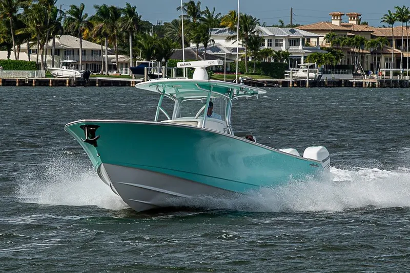 Slide: The Image of 2020 Valhalla Boatworks V-37 cruising on water near waterfront homes. - 5