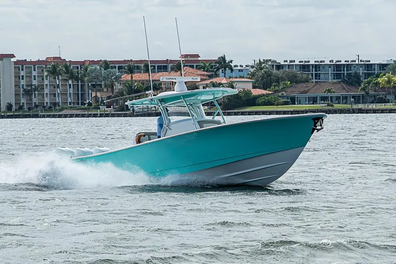 Slide: The Image of 2020 Valhalla Boatworks V-37 cruising on water near coastal buildings. - 7