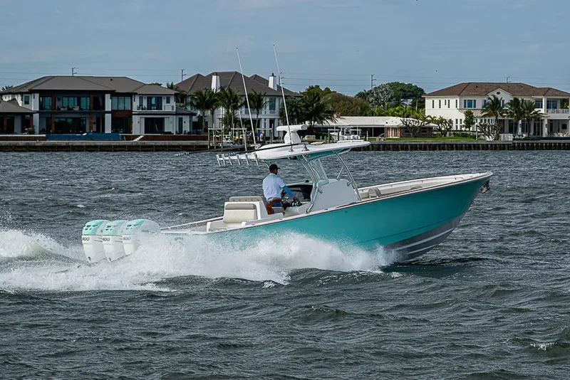 Slide: The Image of 2020 Valhalla Boatworks V-37 cruising on water near waterfront homes. - 8