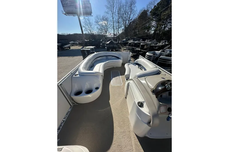 Slide: The Image of 2007 Harris Royal Heritage 260 O/B pontoon boat interior with seating and cup holders. - 13