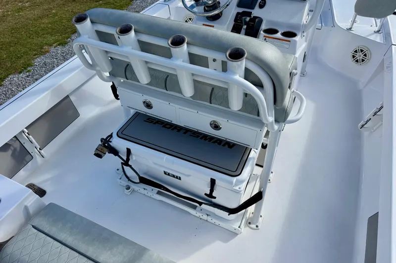 Slide: The Image of 2020 Sportsman Masters 207 Bay Boat interior with seating and rod holders. - 13