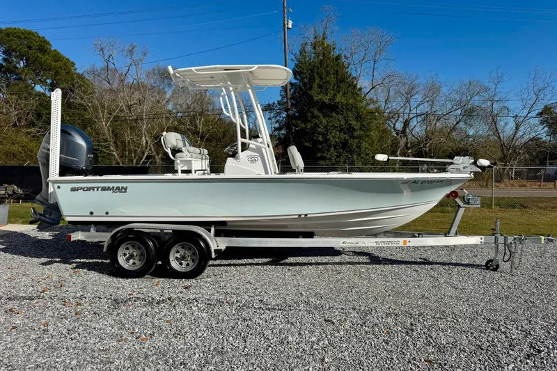Slide: The Image of 2020 Sportsman Masters 207 Bay Boat on trailer, parked outdoors. - 2