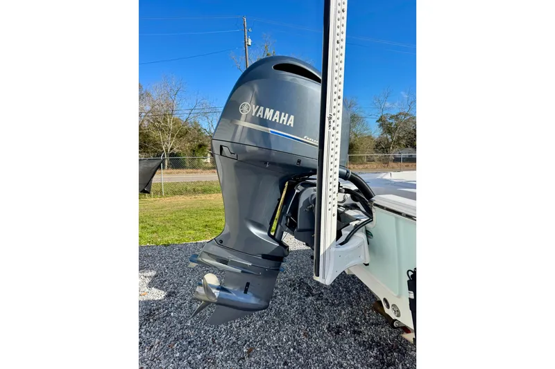 Slide: The Image of 2020 Sportsman Masters 207 Bay Boat with Yamaha outboard motor, parked outdoors. - 4