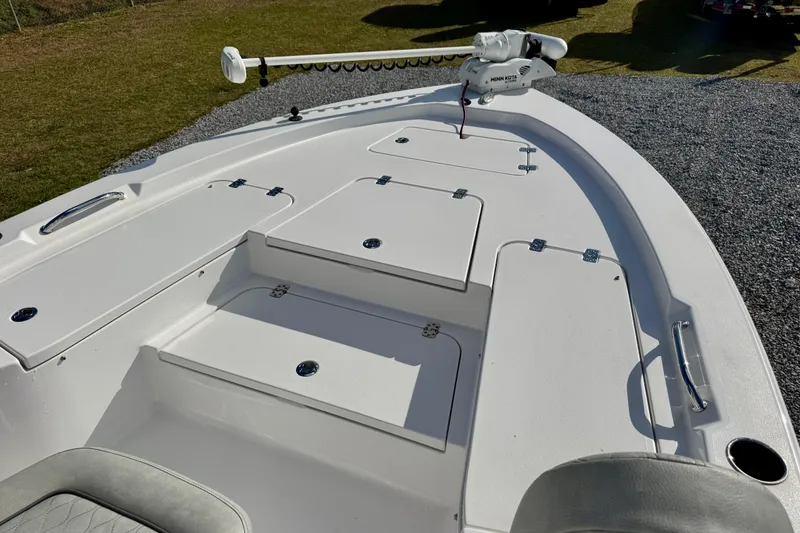 Slide: The Image of 2020 Sportsman Masters 207 Bay Boat deck with storage compartments and trolling motor. - 6