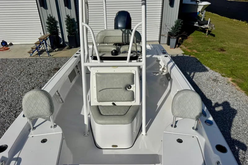 Slide: The Image of 2020 Sportsman Masters 207 Bay Boat with seating and console, parked outdoors. - 7
