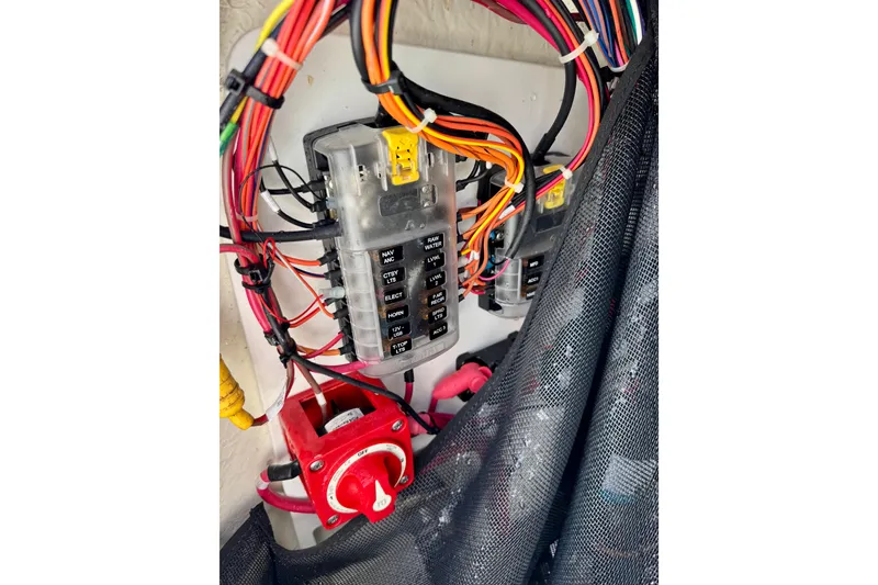 Slide: The Image of Electrical wiring and fuse panel in a 2020 Sportsman Masters 207 Bay Boat. - 9