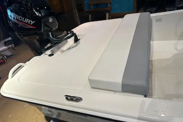 Slide: The Image of 2026 Mako Pro Skiff 13 CC boat with Mercury engine, featuring a sleek white deck. - 6