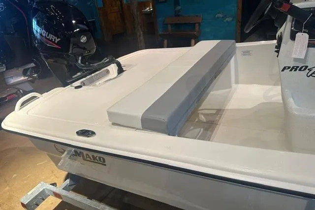 Slide: The Image of 2026 Mako Pro Skiff 13 CC boat with Mercury engine, featuring a sleek white design. - 4