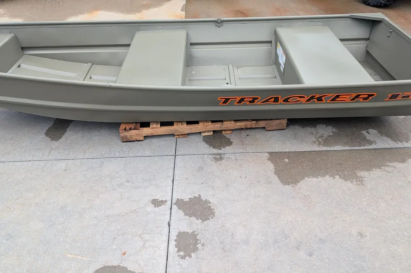 The Image of 2026 Tracker Grizzly 12 Jon boat on wooden pallet, displayed outdoors. - 0