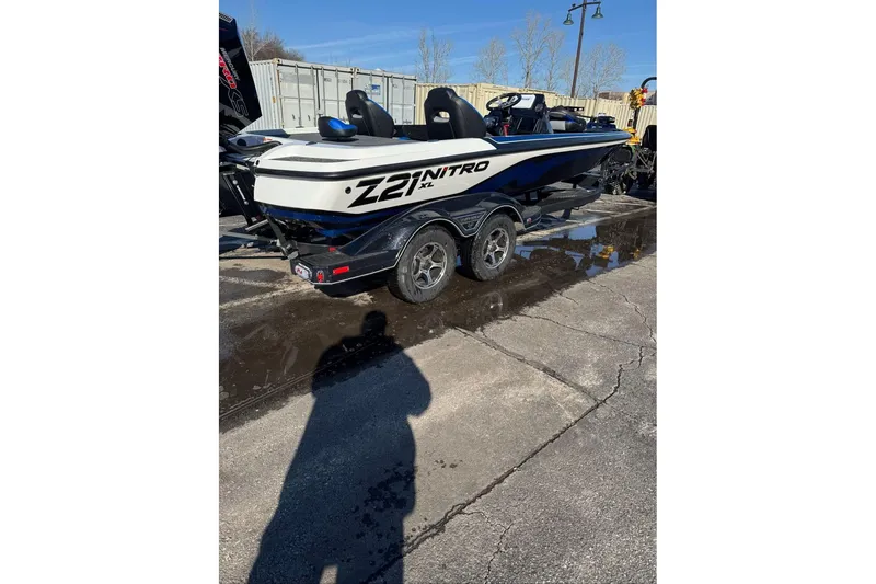 Slide: The Image of 2026 Nitro Z21 XL boat on trailer, parked outdoors on a sunny day. - 112