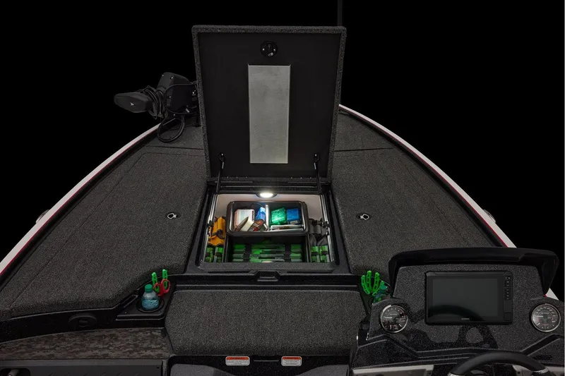 Slide: The Image of 2026 Nitro Z19 XL boat dashboard with controls and gauge in a parking lot. - 20