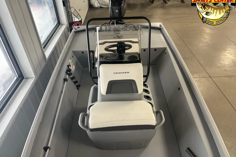 Slide: The Image of 2026 Tracker Bass Tracker Classic CC boat interior with steering console and seating. - 7