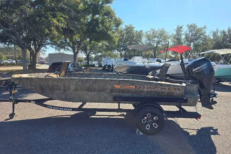 The Image of 2026 Tracker Grizzly 1756 T Marsh boat on trailer, parked outdoors. - 0