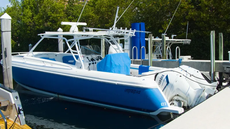 Slide: The Image of 2017 Intrepid 400 Cuddy boat docked at marina. - 1