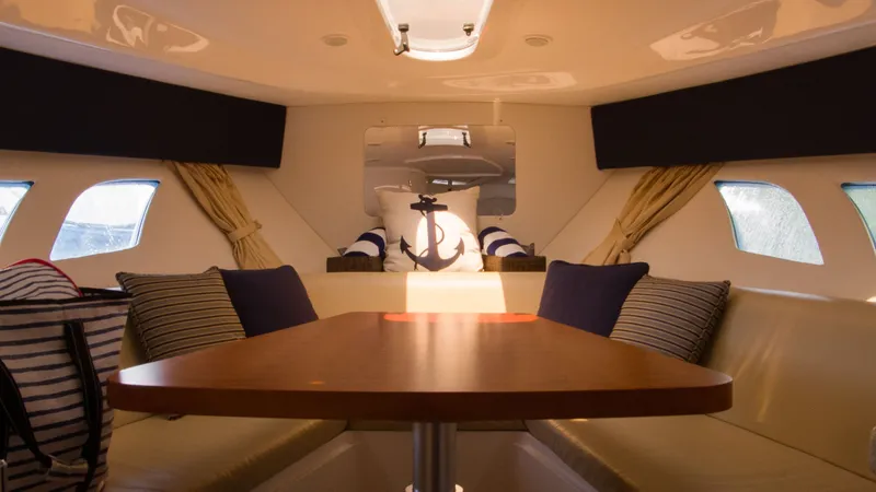 Slide: The Image of Interior of 2017 Intrepid 400 Cuddy with cozy seating area. - 22