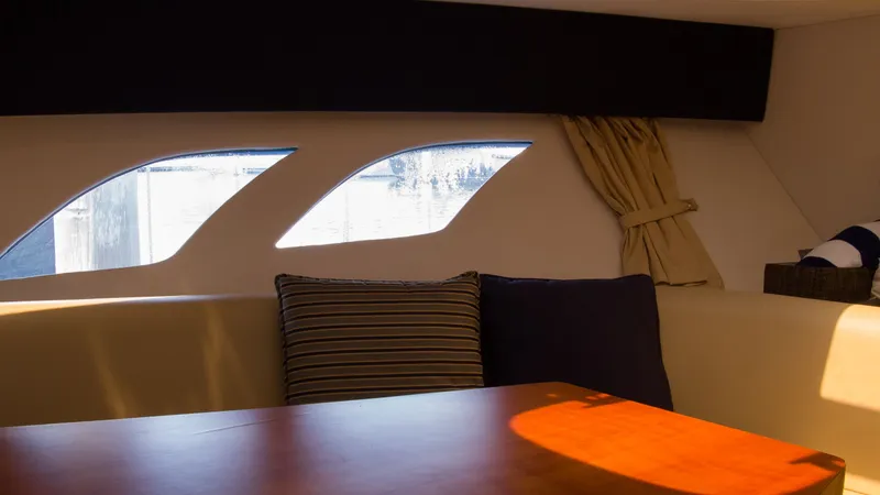 Slide: The Image of Interior of 2017 Intrepid 400 Cuddy with windows and cushions. - 23