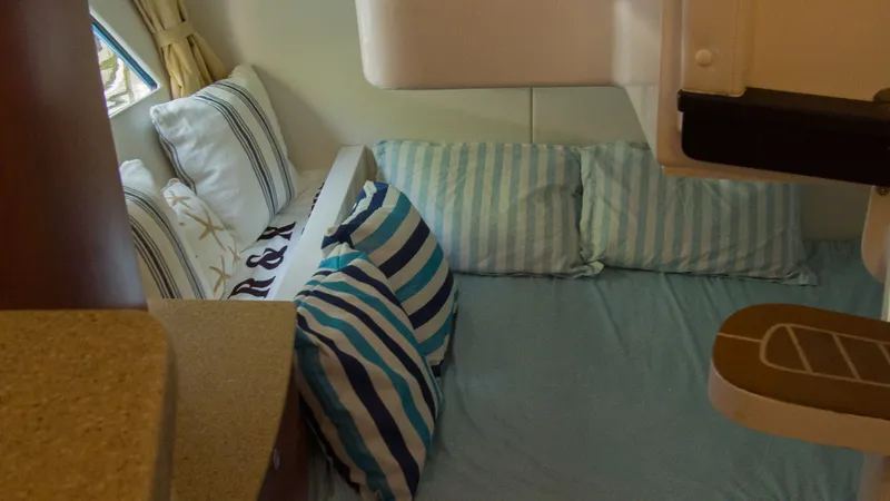 Slide: The Image of Interior of 2017 Intrepid 400 Cuddy with cozy pillows. - 26