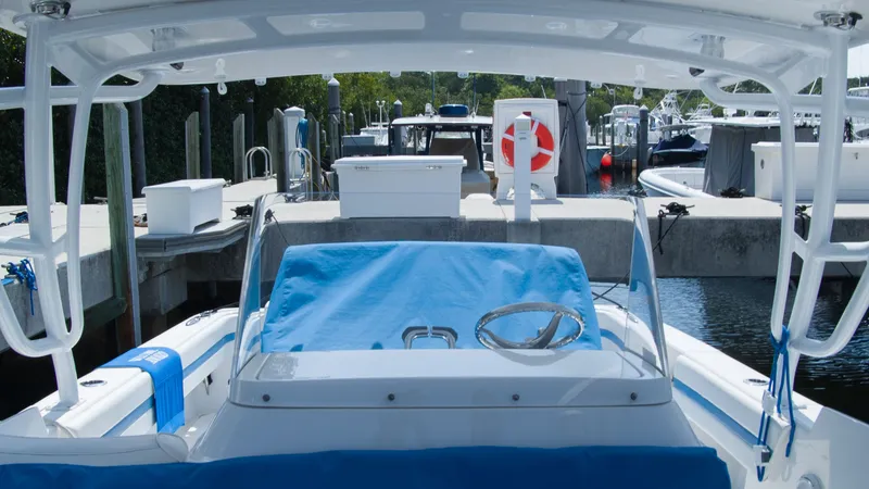 Slide: The Image of Intrepid 400 Cuddy 2017 at dock, featuring blue cover design. - 31