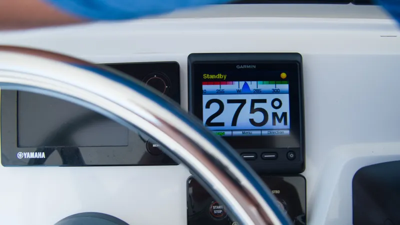 Slide: The Image of Garmin display on 2017 Intrepid 400 Cuddy boat dashboard. - 4