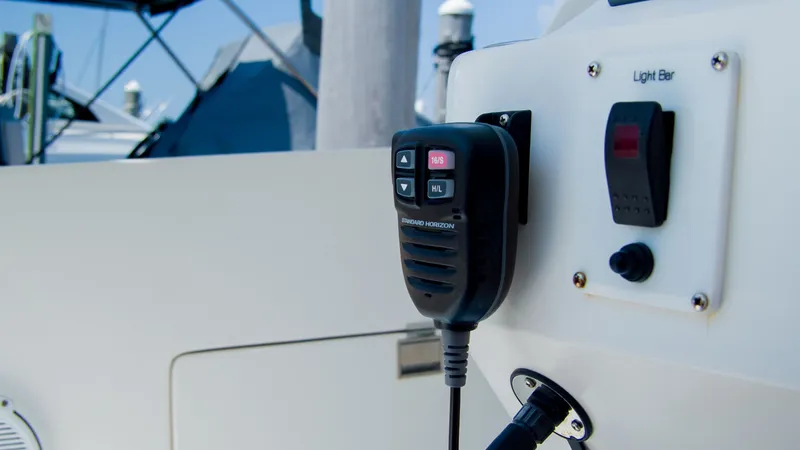 Slide: The Image of 2017 Intrepid 400 Cuddy boat control panel with radio. - 9