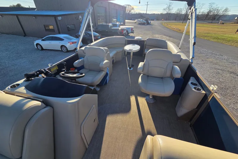 Slide: The Image of 2020 Bentley Pontoons 220 Navigator interior with beige seating and steering console. - 5