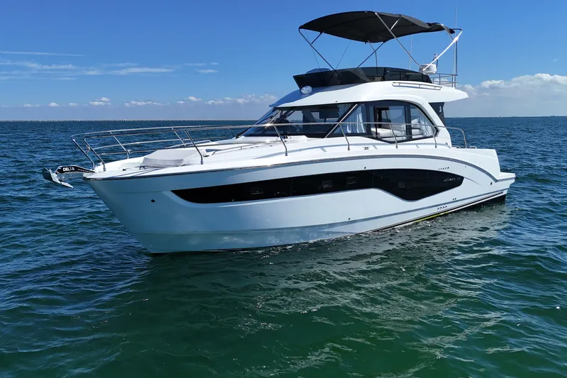 The Image of 2026 Beneteau Antares 12 yacht on open water under clear blue sky. - 0