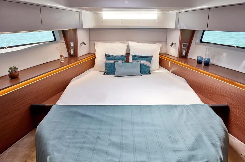 Slide: The Image of Luxurious cabin interior of 2026 Beneteau Antares 12 yacht with elegant bedding and modern design. - 31