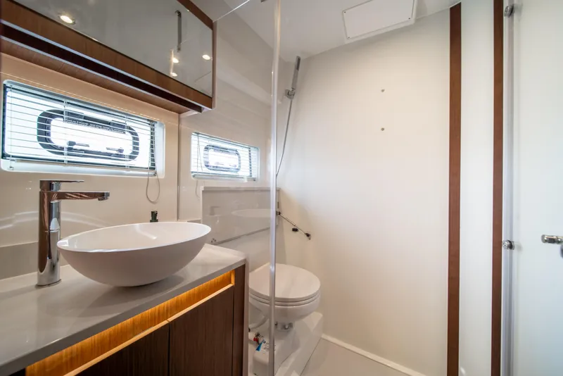 Slide: The Image of Modern bathroom interior on 2026 Beneteau Antares 12 yacht, featuring sleek fixtures and natural lighting. - 35