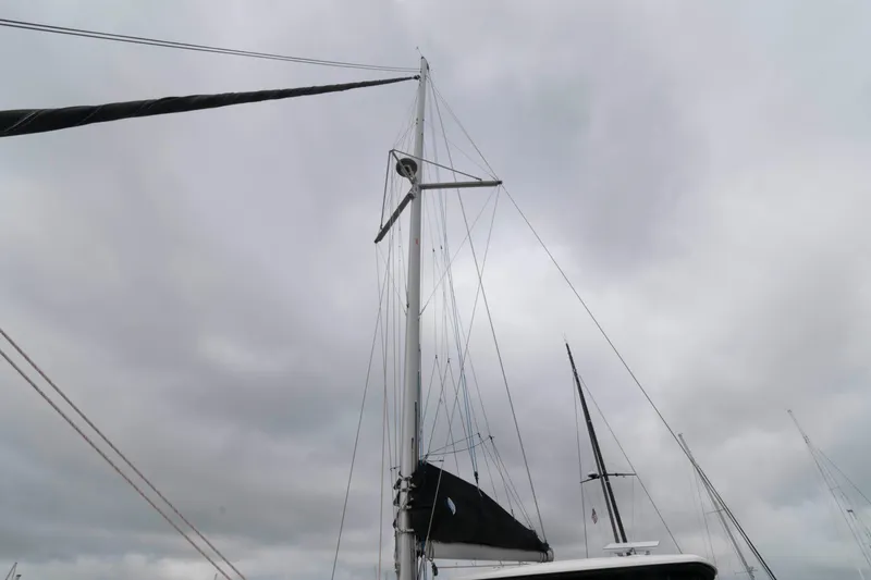 Slide: The Image of Mast of 2019 Lagoon 42 sailboat against cloudy sky. - 23