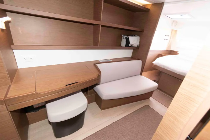Slide: The Image of Interior of 2019 Lagoon 42 yacht with desk, seating, and bed. - 32