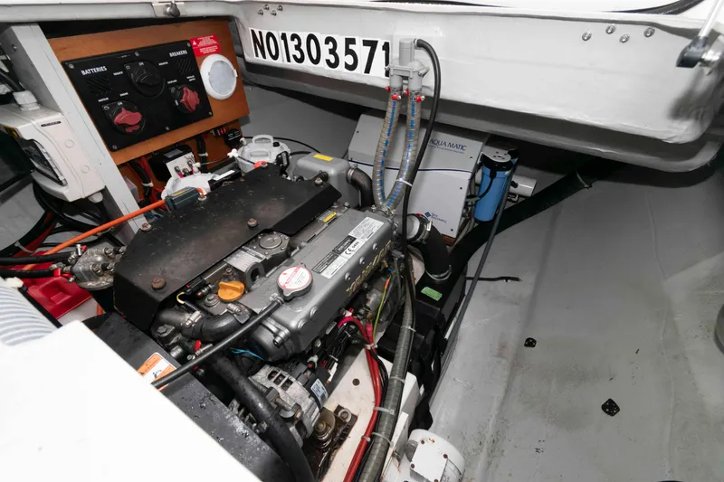 Slide: The Image of Engine compartment of a 2019 Lagoon 42 catamaran, showcasing mechanical components and wiring. - 44