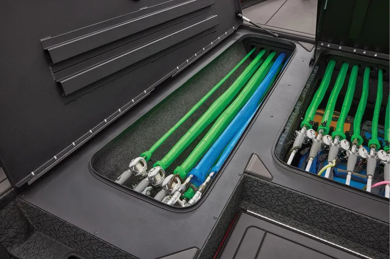 Slide: The Image of Manufacturer Provided Image: Storage compartment of 2026 Tracker Savage 215 boat with organized fishing rods. - 19