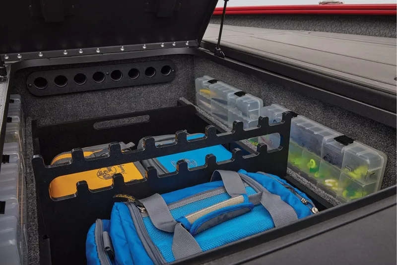 Slide: The Image of Manufacturer Provided Image: Storage compartment of 2026 Tracker Savage 215 with organized fishing gear and tackle boxes. - 23