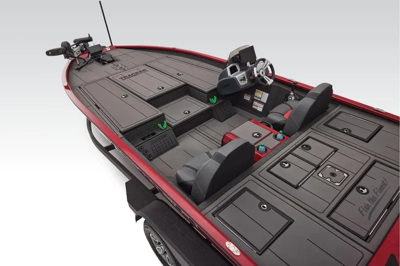 Slide: The Image of Manufacturer Provided Image: 2026 Tracker Savage 215 boat interior with advanced controls and seating, featuring ample storage. - 24
