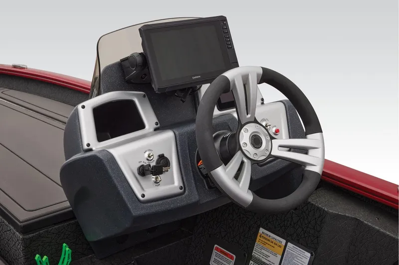 Slide: The Image of Manufacturer Provided Image: 2026 Tracker Savage 215 boat dashboard with steering wheel and control panel. - 28