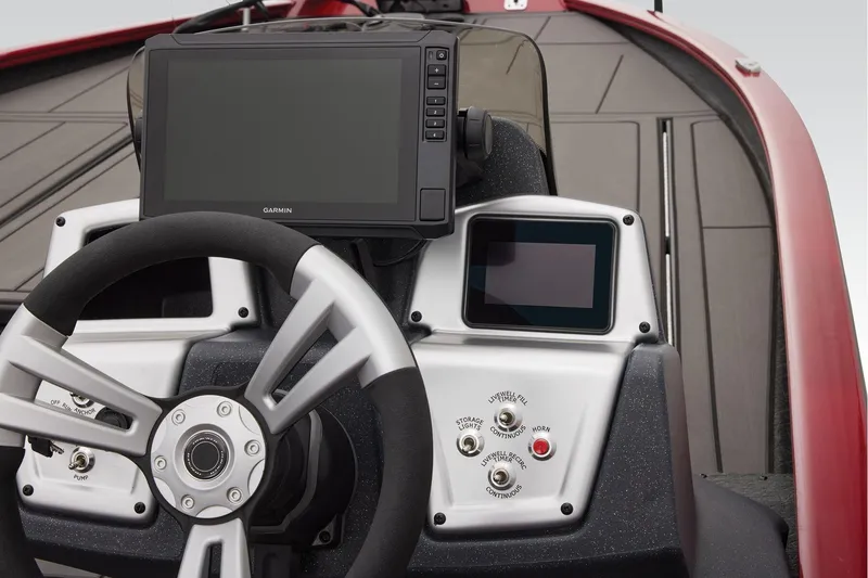 Slide: The Image of Manufacturer Provided Image: 2026 Tracker Savage 215 boat dashboard with steering wheel and digital displays. - 29