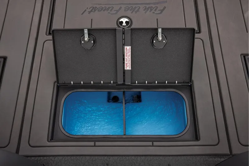 Slide: The Image of Manufacturer Provided Image: Livewell compartment on 2026 Tracker Savage 215 boat, featuring dual lids and blue interior. - 44