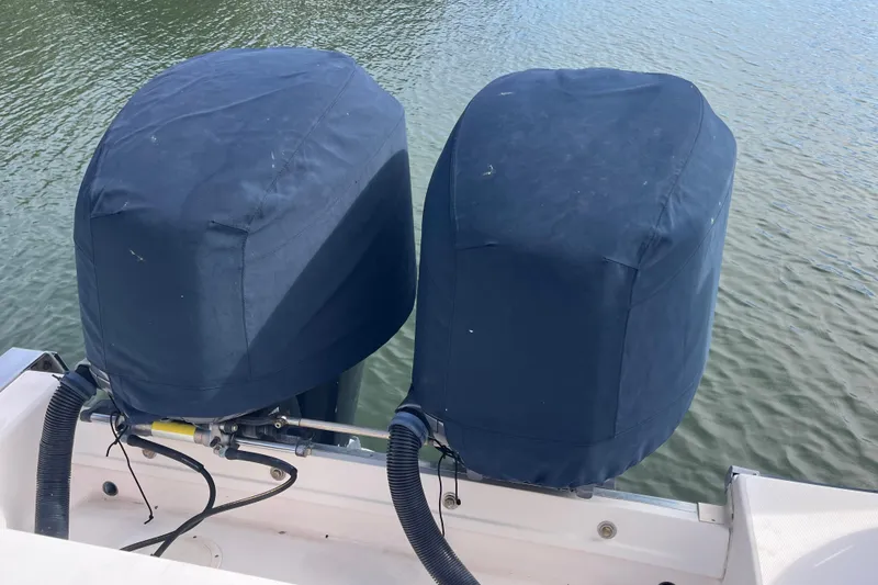 Slide: The Image of Covered outboard motors on a 2006 Grady-White Release 283 boat. - 10