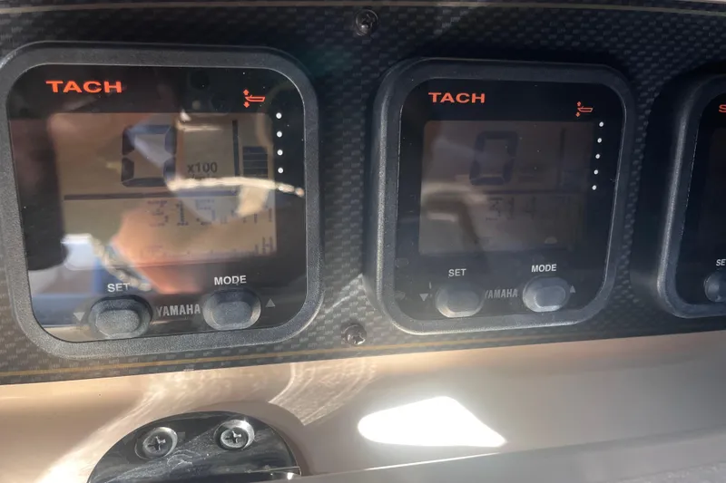 Slide: The Image of Close-up of Yamaha tachometers on a 2006 Grady-White Release 283 boat dashboard. - 15