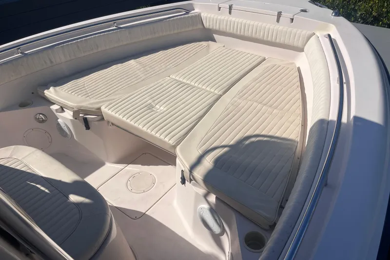 Slide: The Image of 2006 Grady-White Release 283 boat interior with cushioned seating area. - 19