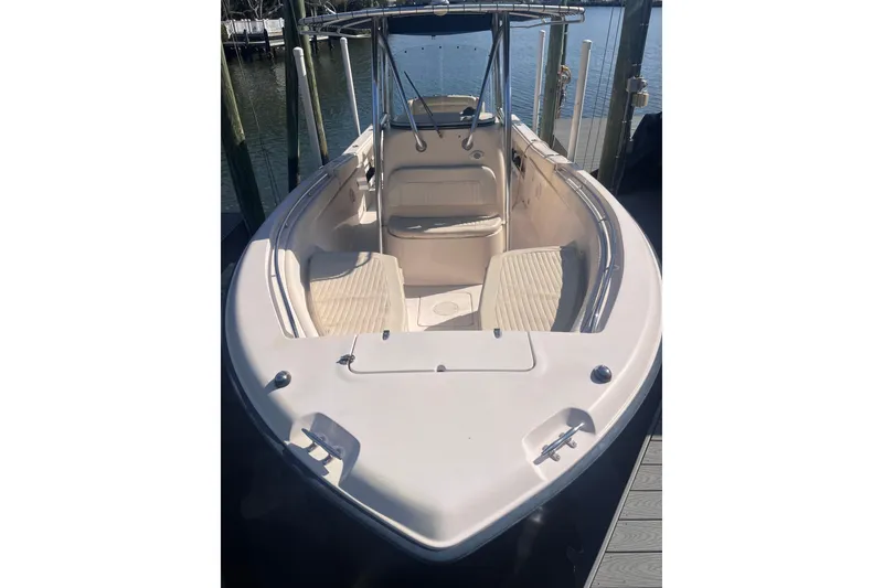 Slide: The Image of 2006 Grady-White Release 283 boat docked, featuring spacious seating and sleek design. - 21