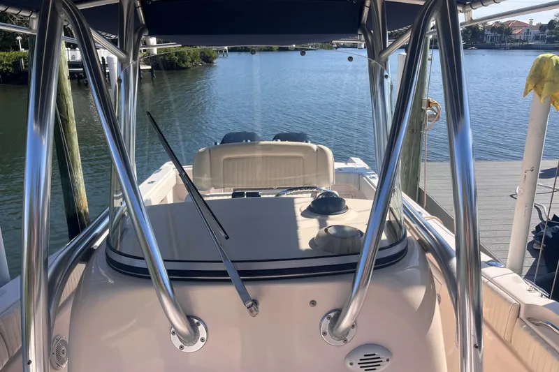 Slide: The Image of 2006 Grady-White Release 283 boat docked by calm waters. - 25