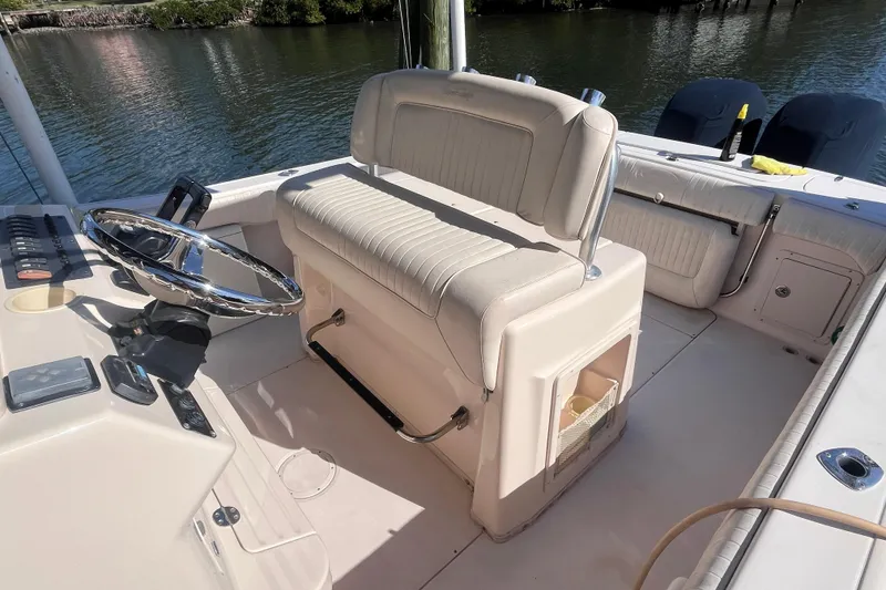 Slide: The Image of 2006 Grady-White Release 283 boat interior with steering wheel and seating. - 27