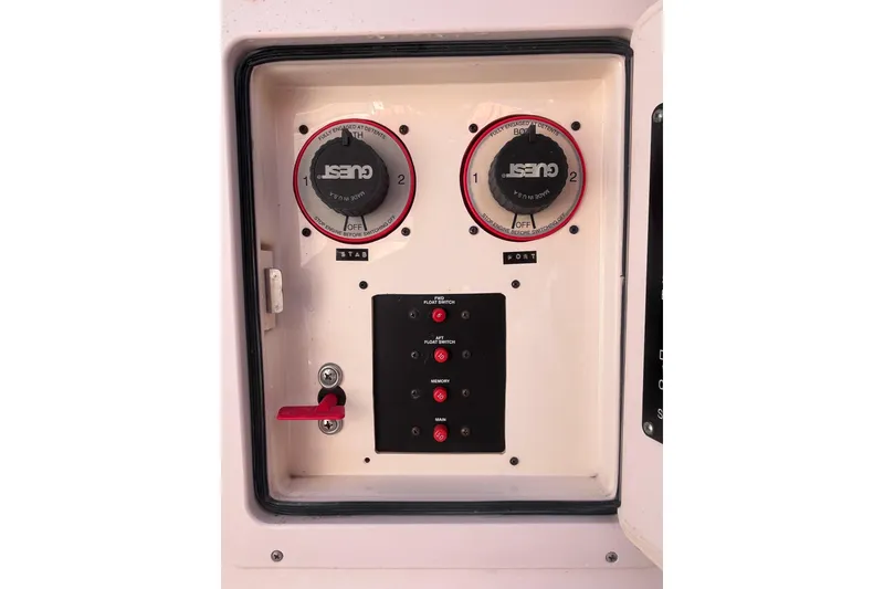 Slide: The Image of Control panel of a 2006 Grady-White Release 283 boat with switches and dials. - 34