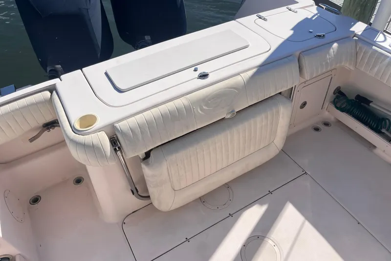Slide: The Image of 2006 Grady-White Release 283 boat interior with seating and storage compartments. - 35