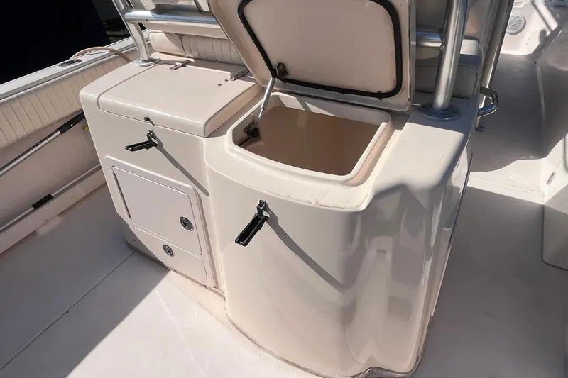 Slide: The Image of 2006 Grady-White Release 283 boat interior with open storage compartment. - 37