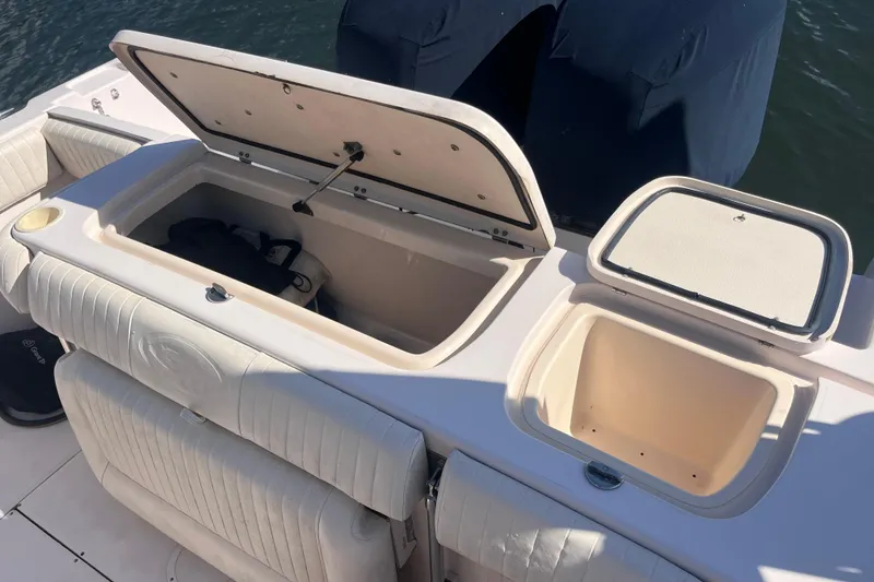 Slide: The Image of 2006 Grady-White Release 283 boat storage compartments open on deck. - 40